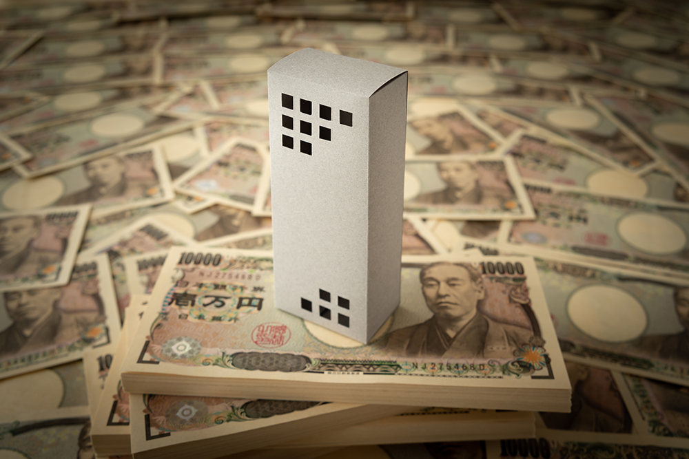 お金とマンションのイメージ