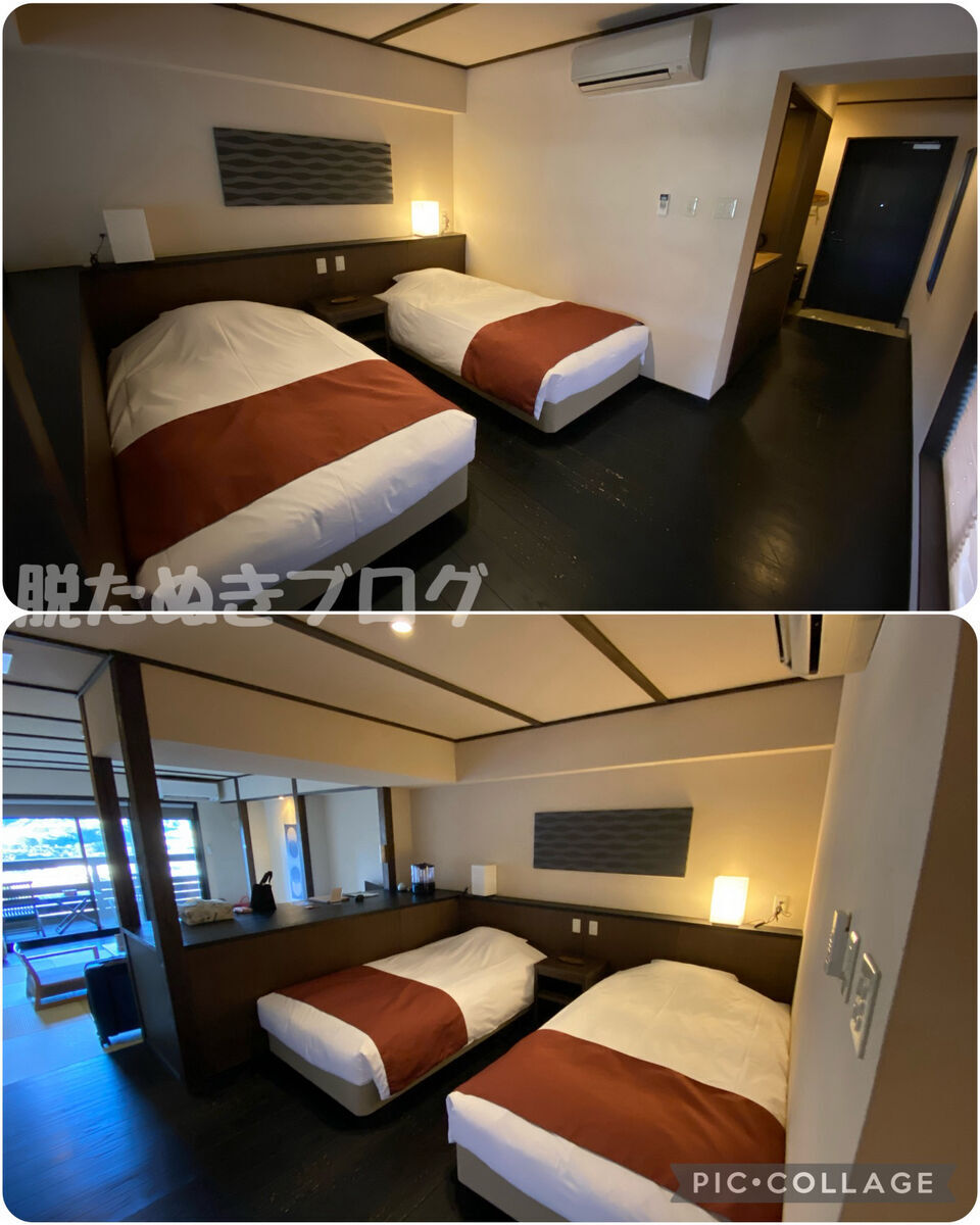 広々としたツインベッドがある部屋の内装。ベッドは大きく、周りには木製の家具が整っている。