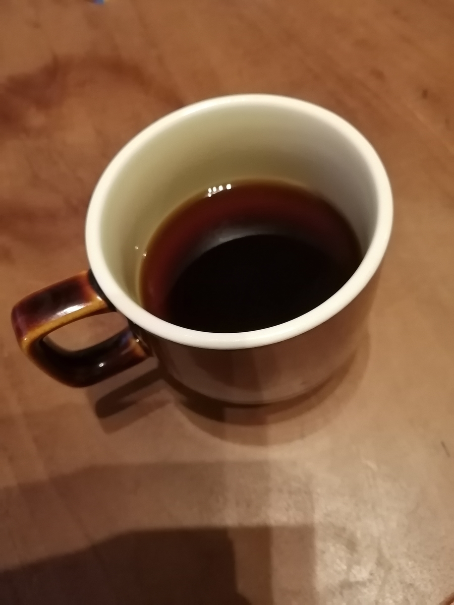 コーヒーの入ったコップの写真