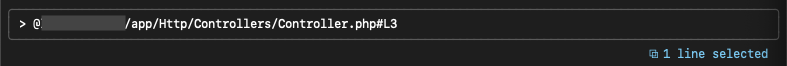 Claude Codeの入力欄にPhpStormで選択したファイル名と行数が入力されているターミナルのスクリーンショットです。